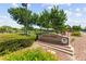 Welcome to Solista Park featuring a lush green space with shady trees, benches, and walking paths at 3058 Casarano Ct, Henderson, NV 89044