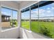 Expansive windows offering panoramic views of a lush green space and neighborhood at 3058 Casarano Ct, Henderson, NV 89044