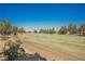 Scenic view of the lush green golf course on a sunny day at 3405 Kingbird Dr, North Las Vegas, NV 89084