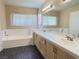 Relaxing bathroom with double sinks, tub, and vanity at 3679 Funston Way, Las Vegas, NV 89129