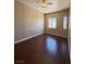 This bedroom boasts wood floors and natural light from two windows at 3679 Funston Way, Las Vegas, NV 89129