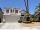 Charming two-story home features a neutral color palette, a two-car garage and desert landscaping at 3679 Funston Way, Las Vegas, NV 89129