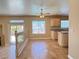 Open kitchen layout with an island, granite countertops, and natural lighting at 3679 Funston Way, Las Vegas, NV 89129