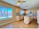 Kitchen featuring granite countertops, an island, and white appliances, with a pool view at 3679 Funston Way, Las Vegas, NV 89129