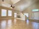 Living area with vaulted ceilings, fireplace, tile flooring, and ceiling fan at 3679 Funston Way, Las Vegas, NV 89129