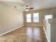 Cozy living room area with large windows, neutral walls, and tile flooring at 3679 Funston Way, Las Vegas, NV 89129