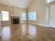 Bright living room with vaulted ceilings, fireplace, and neutral toned walls at 3679 Funston Way, Las Vegas, NV 89129