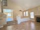 Spacious living room featuring tile flooring, fireplace, and plenty of natural light at 3679 Funston Way, Las Vegas, NV 89129