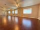 Large main bedroom with mirrored closet doors and wood floors at 3679 Funston Way, Las Vegas, NV 89129