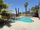 Beautiful backyard oasis featuring a sparkling swimming pool, hot tub, and lush landscaping at 3679 Funston Way, Las Vegas, NV 89129