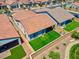 Aerial view of a backyard featuring lush artificial grass and a covered patio at 369 Old Erie Pl, Henderson, NV 89011