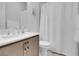 Bathroom featuring a white sink and toilet, light tile floor and a white shower curtain at 369 Old Erie Pl, Henderson, NV 89011