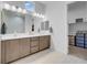Spacious bathroom with double vanity, large mirrors, and walk-in closet at 369 Old Erie Pl, Henderson, NV 89011