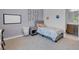 Cozy bedroom featuring a neutral palette, plush carpet, and a modern bed with a gray frame at 369 Old Erie Pl, Henderson, NV 89011