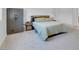 Cozy bedroom with soft carpeting, a large gun safe, and neutral decor, creating a peaceful retreat at 369 Old Erie Pl, Henderson, NV 89011