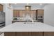 Modern kitchen featuring a large center island, white subway tile backsplash, and stainless steel appliances at 369 Old Erie Pl, Henderson, NV 89011