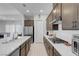 Spacious kitchen with an expansive island, stainless steel appliances, and ample counter space for meal preparation at 369 Old Erie Pl, Henderson, NV 89011