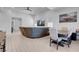 Open-concept living room with a dining table and comfortable sectional couch at 369 Old Erie Pl, Henderson, NV 89011