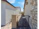 Private side yard entrance featuring a metal gate with no soliciting sign at 369 Old Erie Pl, Henderson, NV 89011