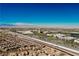 Expansive aerial view of a community with mountain views under a clear blue sky at 390 Coastal Redwood St, Las Vegas, NV 89138