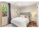 Cozy bedroom with a comfortable bed, stylish side table, and a view of lush greenery outside the window at 390 Coastal Redwood St, Las Vegas, NV 89138