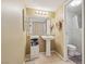 Cozy bathroom featuring tile flooring, pedestal sink, and a well-lit mirror at 3930 University Center Dr # 804, Las Vegas, NV 89119