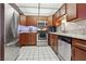 Updated kitchen with stainless steel appliances, granite countertops, and wood cabinetry at 3930 University Center Dr # 804, Las Vegas, NV 89119