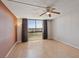 Large, open living room with floor-to-ceiling windows and contemporary light fixture at 3930 University Center Dr # 804, Las Vegas, NV 89119