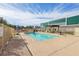 Inviting community pool with lounge chairs and shaded pergola, perfect for relaxing and enjoying sunny days at 3930 University Center Dr # 804, Las Vegas, NV 89119