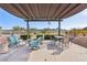 Inviting pool area with comfortable seating, pergola, and an American flag in the background at 3930 University Center Dr # 804, Las Vegas, NV 89119
