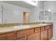 Bathroom features a double sink vanity with granite countertops and sleek fixtures at 3949 Amanda Bay Ave, North Las Vegas, NV 89081