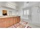 Bathroom with double sinks, separate tub, and glass shower, offering a spa-like experience at 3949 Amanda Bay Ave, North Las Vegas, NV 89081