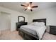 Spacious bedroom with a dark wood dresser and nightstands at 3949 Amanda Bay Ave, North Las Vegas, NV 89081