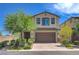 Charming two-story home features a landscaped front yard and a two-car garage with brick paved driveway at 3949 Amanda Bay Ave, North Las Vegas, NV 89081