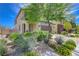 Attractive exterior view featuring desert landscaping, a brick-paved driveway, and a covered porch at 3949 Amanda Bay Ave, North Las Vegas, NV 89081
