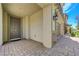 Inviting front entry with a covered porch and a view of the garage with stone facade at 3949 Amanda Bay Ave, North Las Vegas, NV 89081