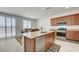 Bright kitchen featuring an island, stainless appliances, and dining area at 3949 Amanda Bay Ave, North Las Vegas, NV 89081