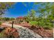 Tranquil park setting with winding paths, seating areas, mature landscaping, and a covered gazebo at 3949 Amanda Bay Ave, North Las Vegas, NV 89081