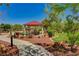 Picturesque community park featuring walking paths, seating, a covered picnic area, and beautiful landscaping at 3949 Amanda Bay Ave, North Las Vegas, NV 89081