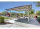 Community picnic area with shelter, tables, playground, and green space for residents' enjoyment at 3949 Amanda Bay Ave, North Las Vegas, NV 89081