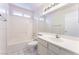 Clean bathroom featuring a tub, toilet, and vanity with white tile floors at 4516 Cielo Ln, Las Vegas, NV 89130
