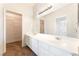 Bathroom featuring a large mirror, updated vanity, and walk-in closet at 4516 Cielo Ln, Las Vegas, NV 89130