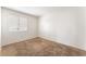 Bedroom with carpet, a window with blinds, and neutral walls at 4516 Cielo Ln, Las Vegas, NV 89130