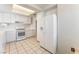 Spacious kitchen with white cabinetry, appliances, and ample counter space at 4516 Cielo Ln, Las Vegas, NV 89130