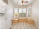 Bright eat-in kitchen with built-in bench seating and large windows at 4516 Cielo Ln, Las Vegas, NV 89130