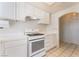 Updated kitchen featuring white cabinets and modern gas range at 4516 Cielo Ln, Las Vegas, NV 89130