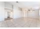Expansive living room with tile floors, ceiling fan, and easy access to other rooms at 4516 Cielo Ln, Las Vegas, NV 89130