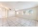 Spacious living room with tile flooring, ceiling fan, and ample natural light at 4516 Cielo Ln, Las Vegas, NV 89130