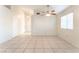 Open living area features tile floors, ceiling fan, and neutral paint at 4516 Cielo Ln, Las Vegas, NV 89130