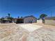 Backyard offers a large, paved patio, perfect for outdoor gatherings and recreation at 4823 El Tesoro Ave, Las Vegas, NV 89121